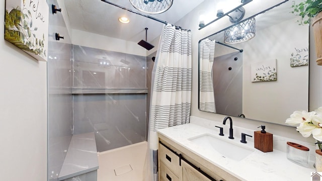 bathroom with vanity and a shower with shower curtain