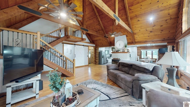 living room featuring high vaulted ceiling, beam ceiling, ceiling fan, and light hardwood / wood-style flooring