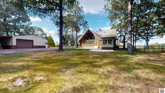 view of yard featuring an outbuilding and a garage