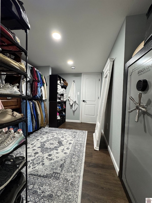 walk in closet featuring dark hardwood / wood-style floors