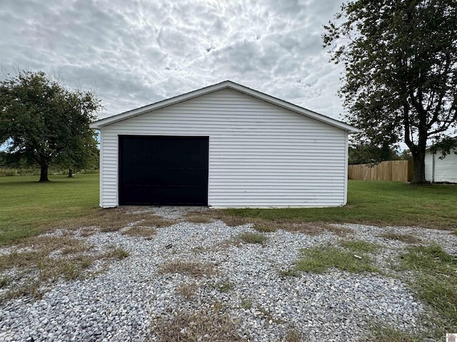 garage featuring a yard