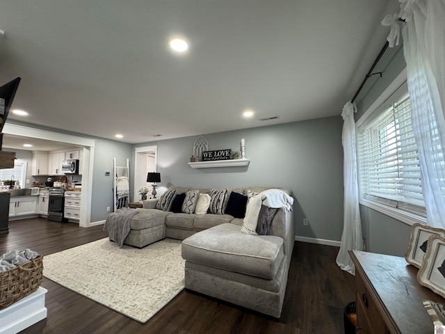 living room featuring dark hardwood / wood-style floors