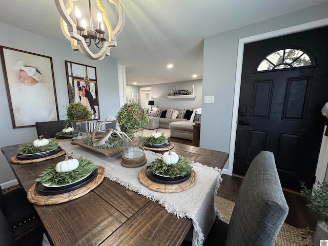 dining room with a chandelier and hardwood / wood-style flooring