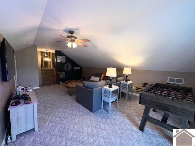 carpeted living room featuring vaulted ceiling and ceiling fan