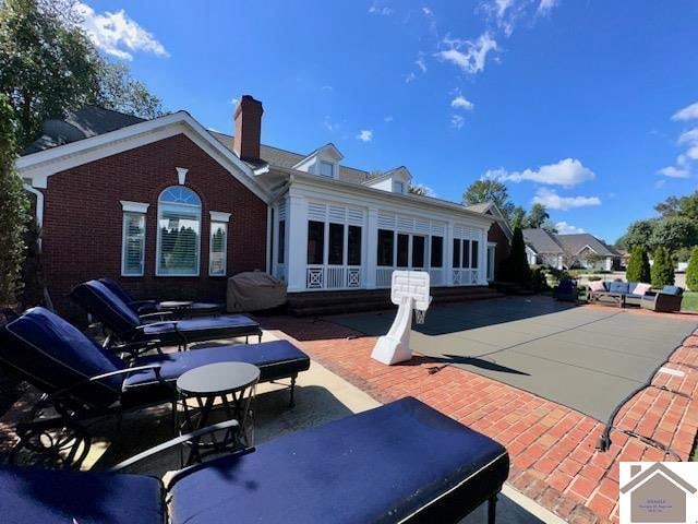 back of house featuring a patio area