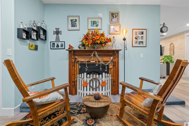 living area with hardwood / wood-style flooring