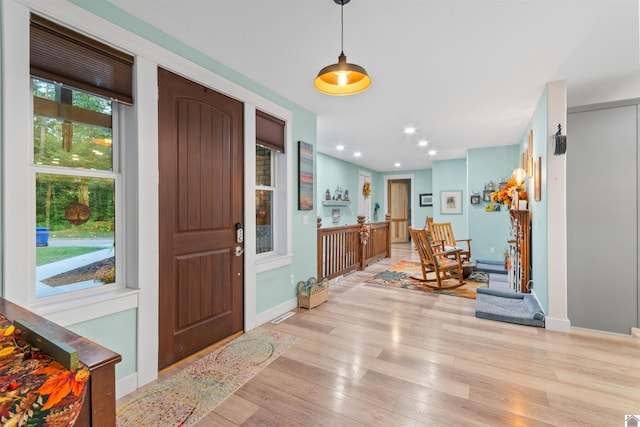 foyer entrance featuring light hardwood / wood-style flooring