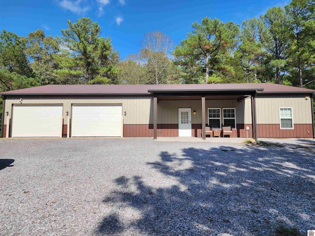 view of front of house featuring a garage and covered porch