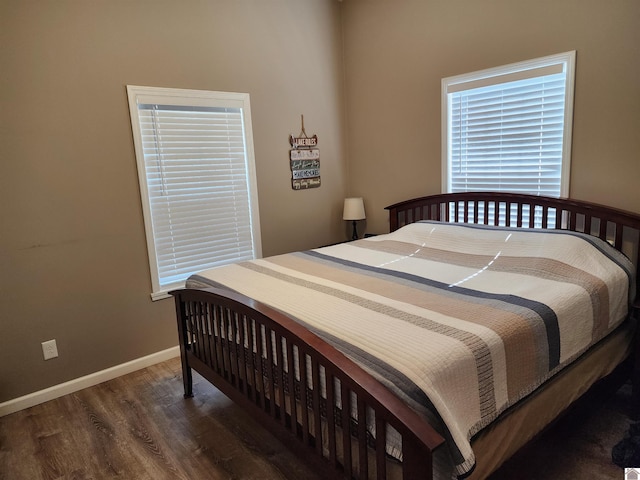 bedroom featuring dark wood-type flooring