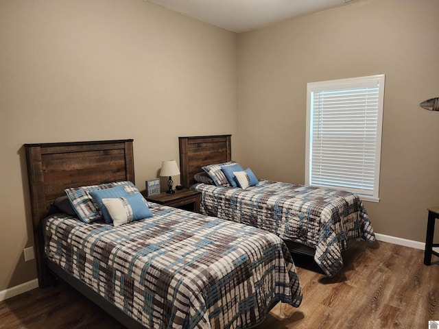 bedroom featuring dark wood-type flooring