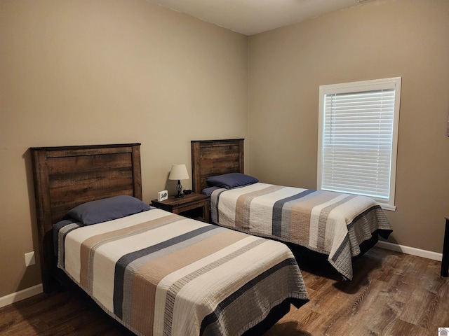 bedroom featuring dark hardwood / wood-style flooring