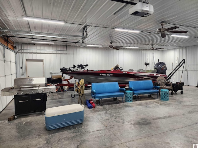 garage with a garage door opener and ceiling fan