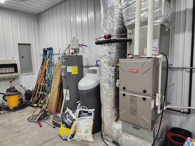 utilities featuring water heater, electric panel, and heating unit