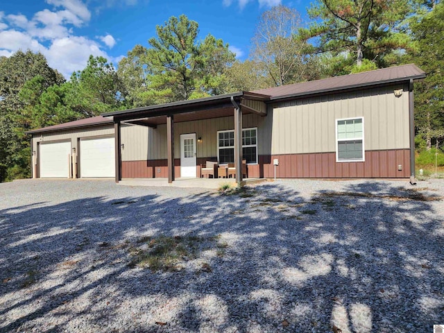 view of front of home with a porch and a garage