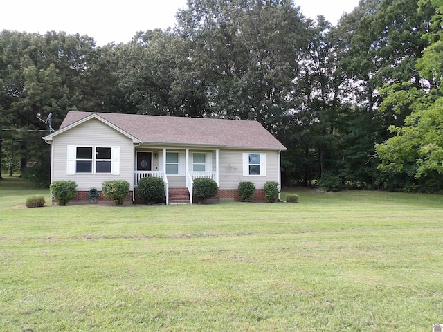 ranch-style house featuring a front yard and a porch