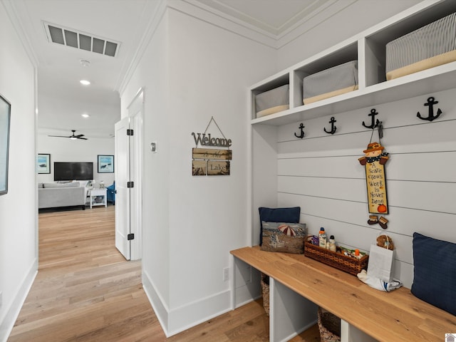 mudroom with light hardwood / wood-style flooring, ceiling fan, and crown molding