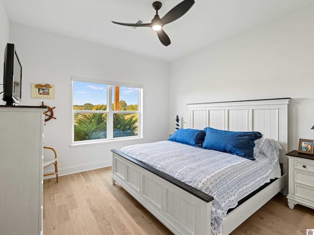 bedroom featuring light wood-type flooring and ceiling fan