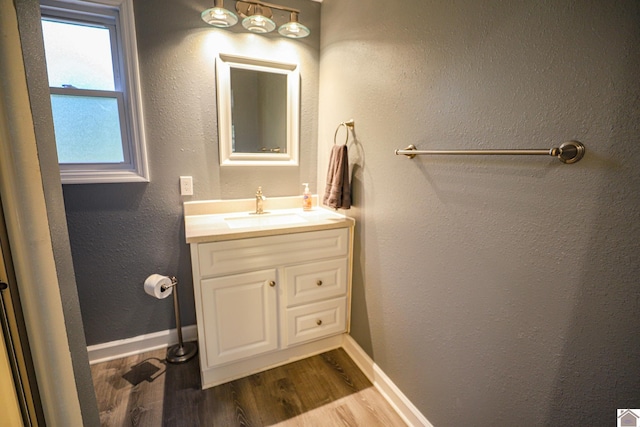 bathroom with vanity and hardwood / wood-style floors