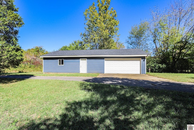 garage featuring a yard