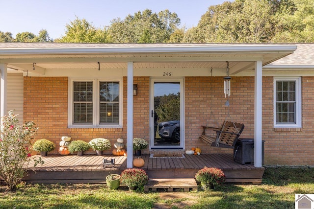 property entrance with covered porch