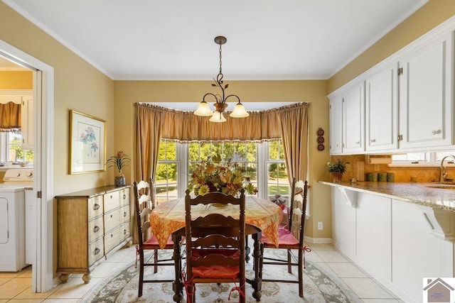 dining room with washer / clothes dryer, light tile patterned flooring, and plenty of natural light