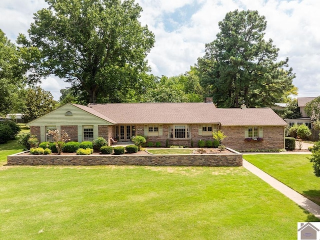 single story home featuring a front lawn