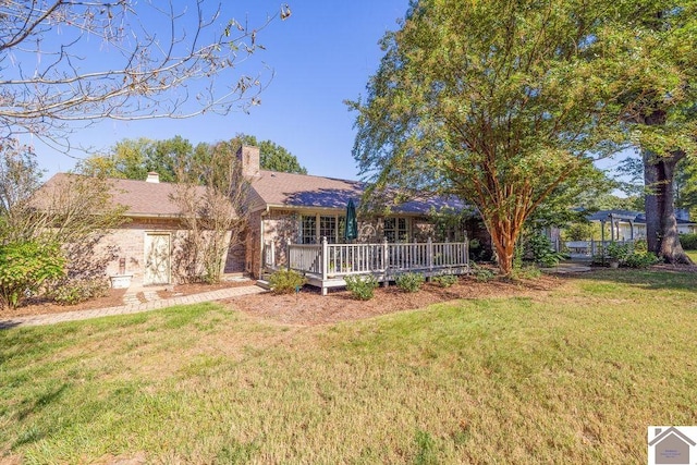 view of yard with a wooden deck