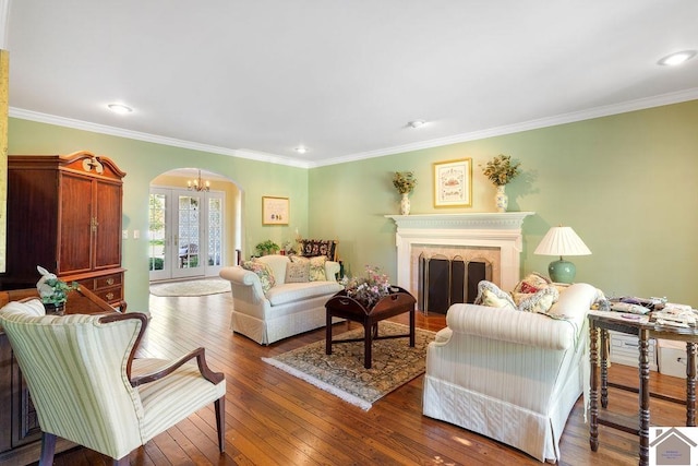 living room featuring ornamental molding, french doors, and wood-type flooring