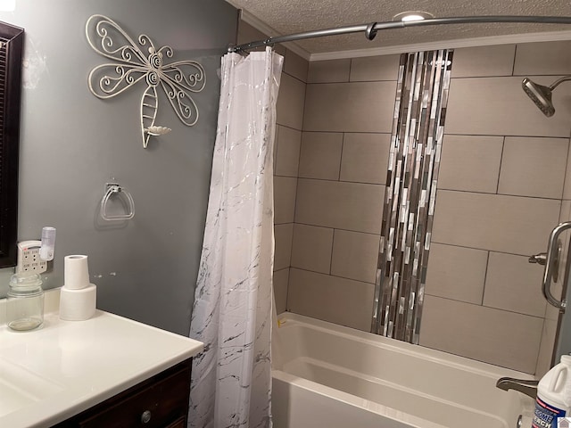 bathroom with shower / tub combo, vanity, and a textured ceiling