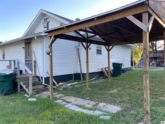 view of side of home featuring a lawn