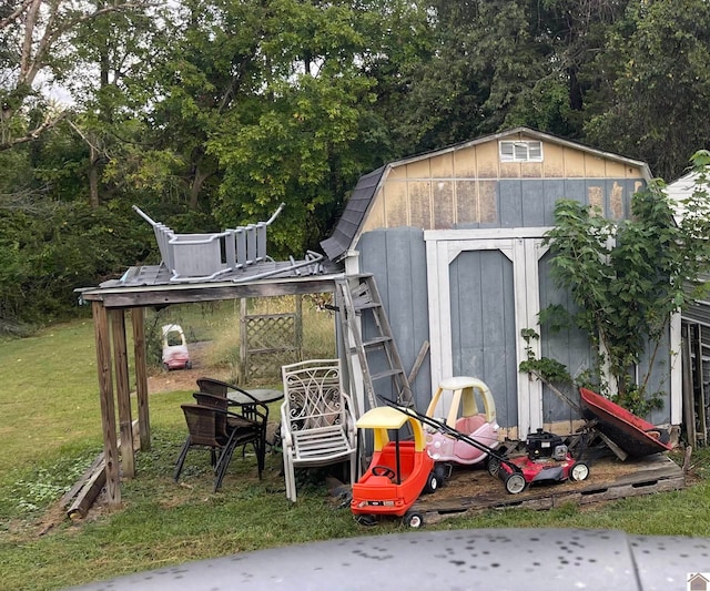 view of outbuilding with a yard