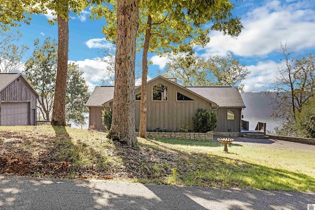 view of front of house with a garage and a front yard