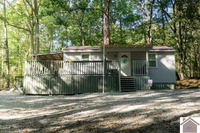 view of front of property featuring a wooden deck