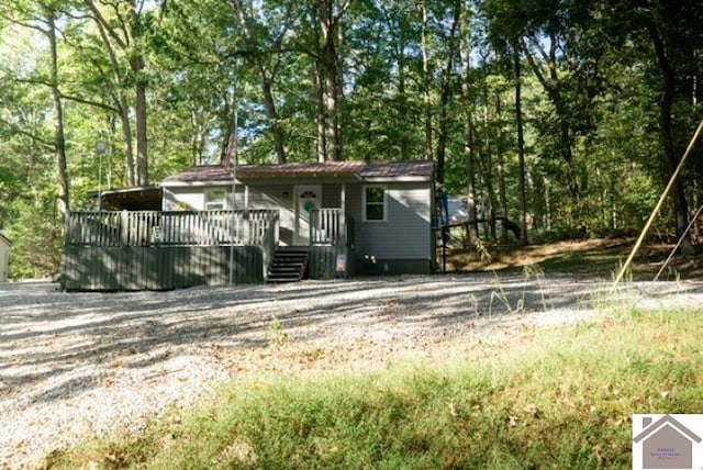 view of front of property featuring a wooden deck