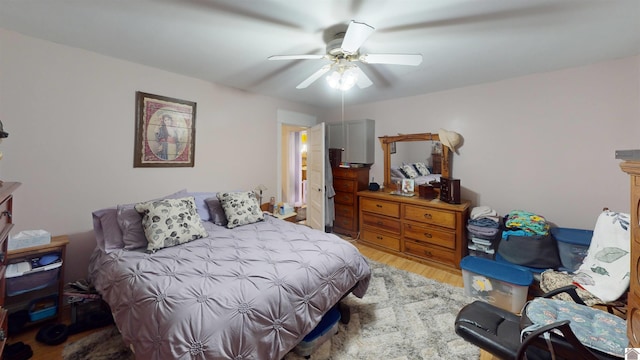 bedroom with ceiling fan and wood-type flooring