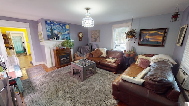 living room featuring an inviting chandelier and hardwood / wood-style floors