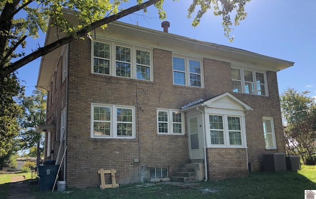 rear view of house with central air condition unit