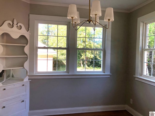 interior space with ornamental molding and a notable chandelier