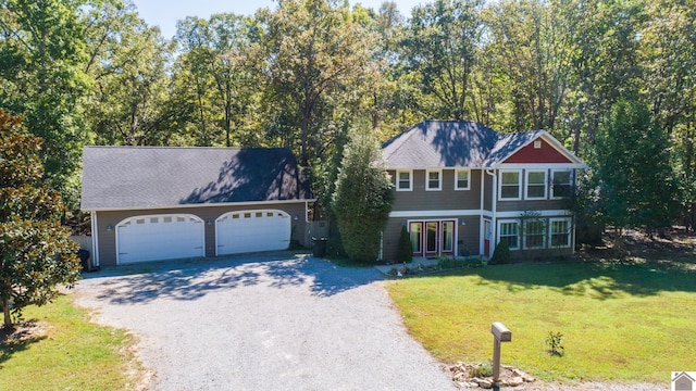 front of property featuring a garage and a front lawn