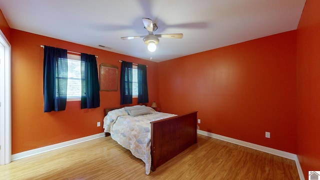 bedroom featuring wood-type flooring and ceiling fan