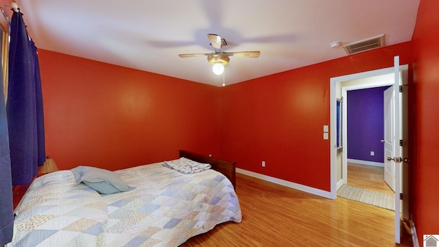 bedroom featuring ceiling fan and hardwood / wood-style floors