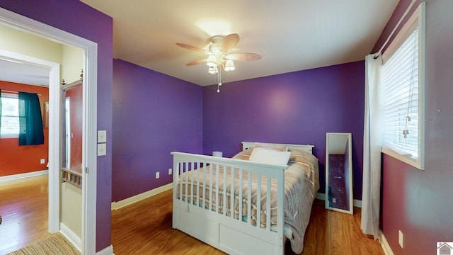 bedroom featuring hardwood / wood-style flooring and ceiling fan