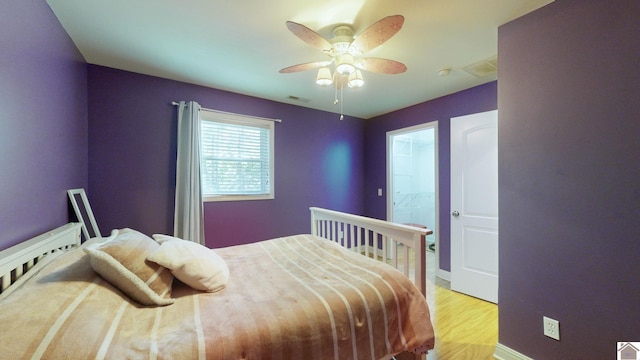 bedroom with ceiling fan and light wood-type flooring