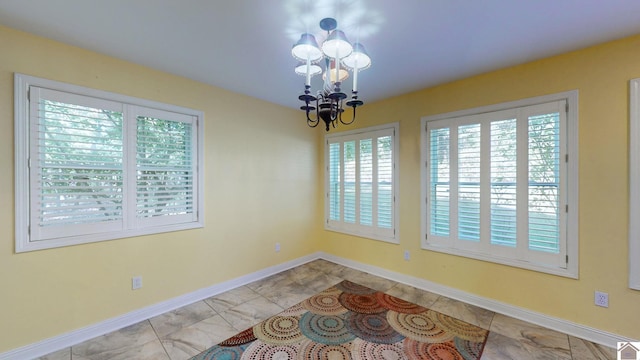 dining space featuring an inviting chandelier