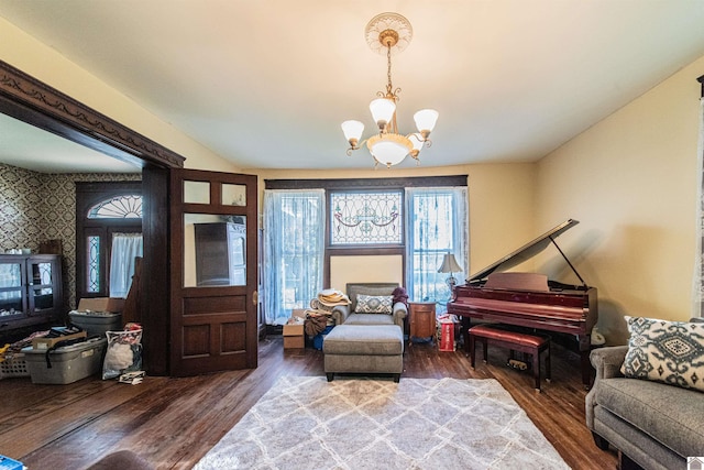 sitting room with a notable chandelier and wood-type flooring