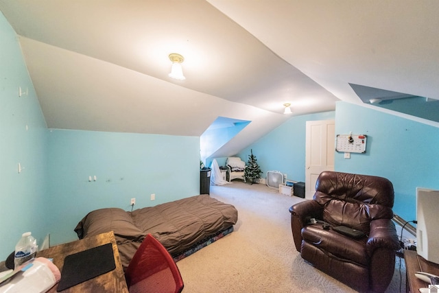 carpeted bedroom featuring lofted ceiling