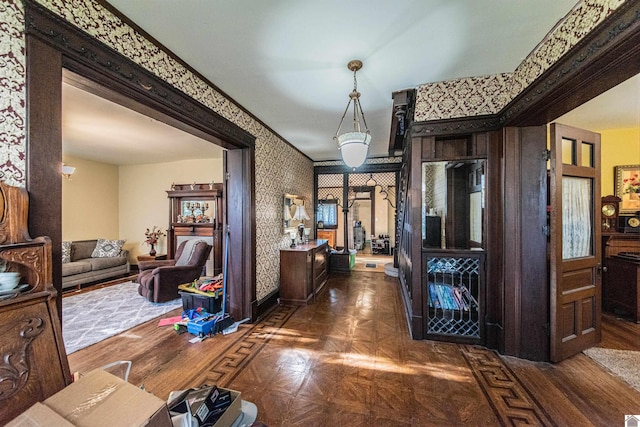 hallway featuring dark parquet flooring