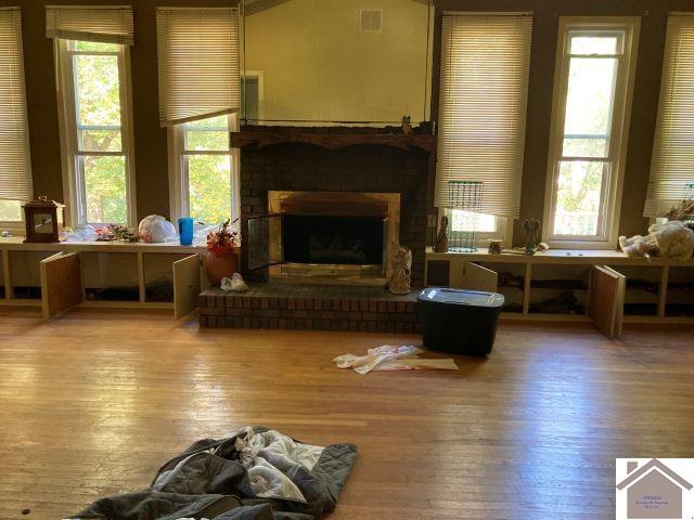 living area featuring a fireplace and hardwood / wood-style floors