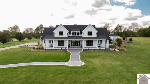 cape cod-style house with a front yard