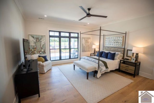 bedroom with ornamental molding, light hardwood / wood-style flooring, and ceiling fan